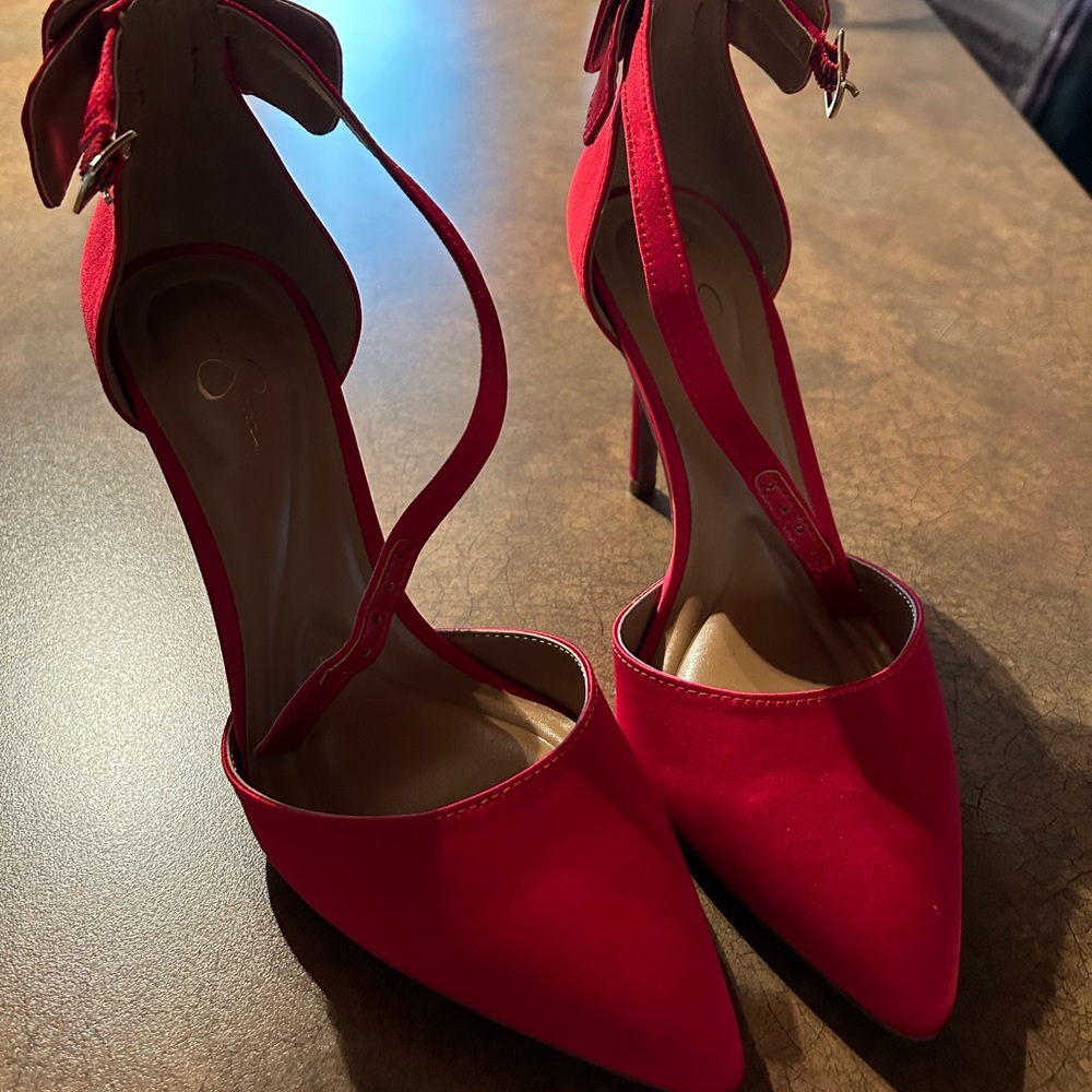 Red Jessica Simpson heels with bow detail